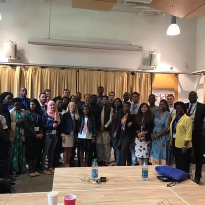 Large Kectil group gathered indoors for a program photo.