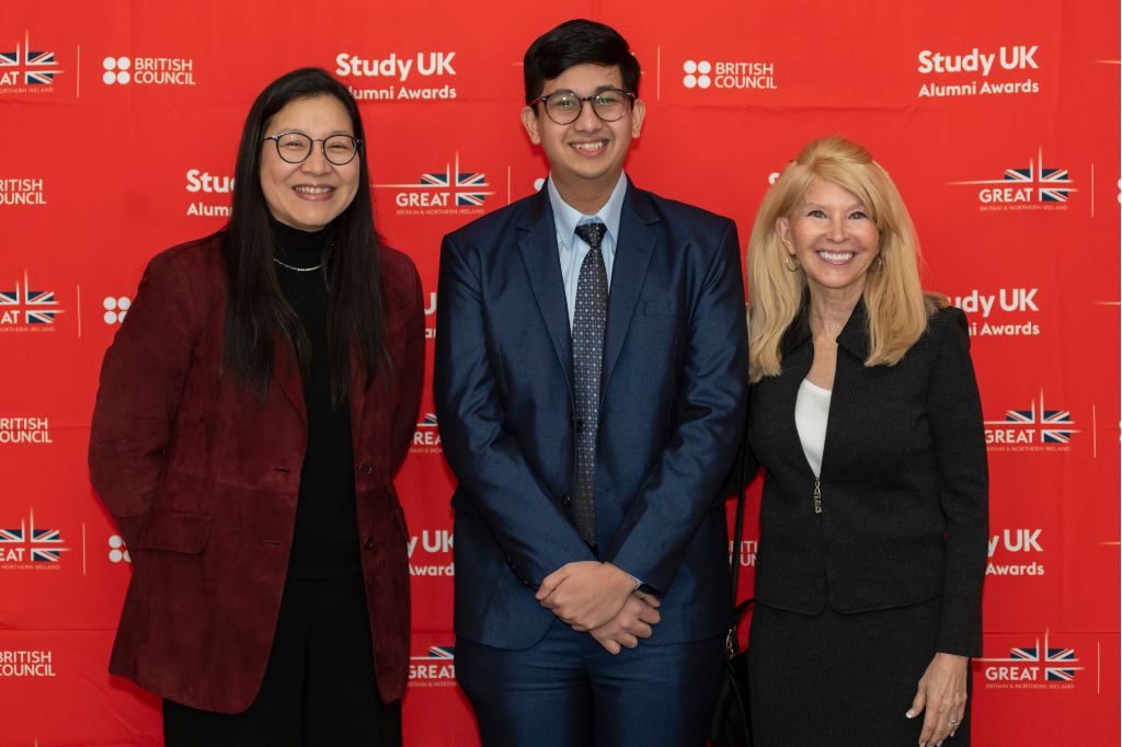 Kectil participants standing together at a Study UK event backdrop.