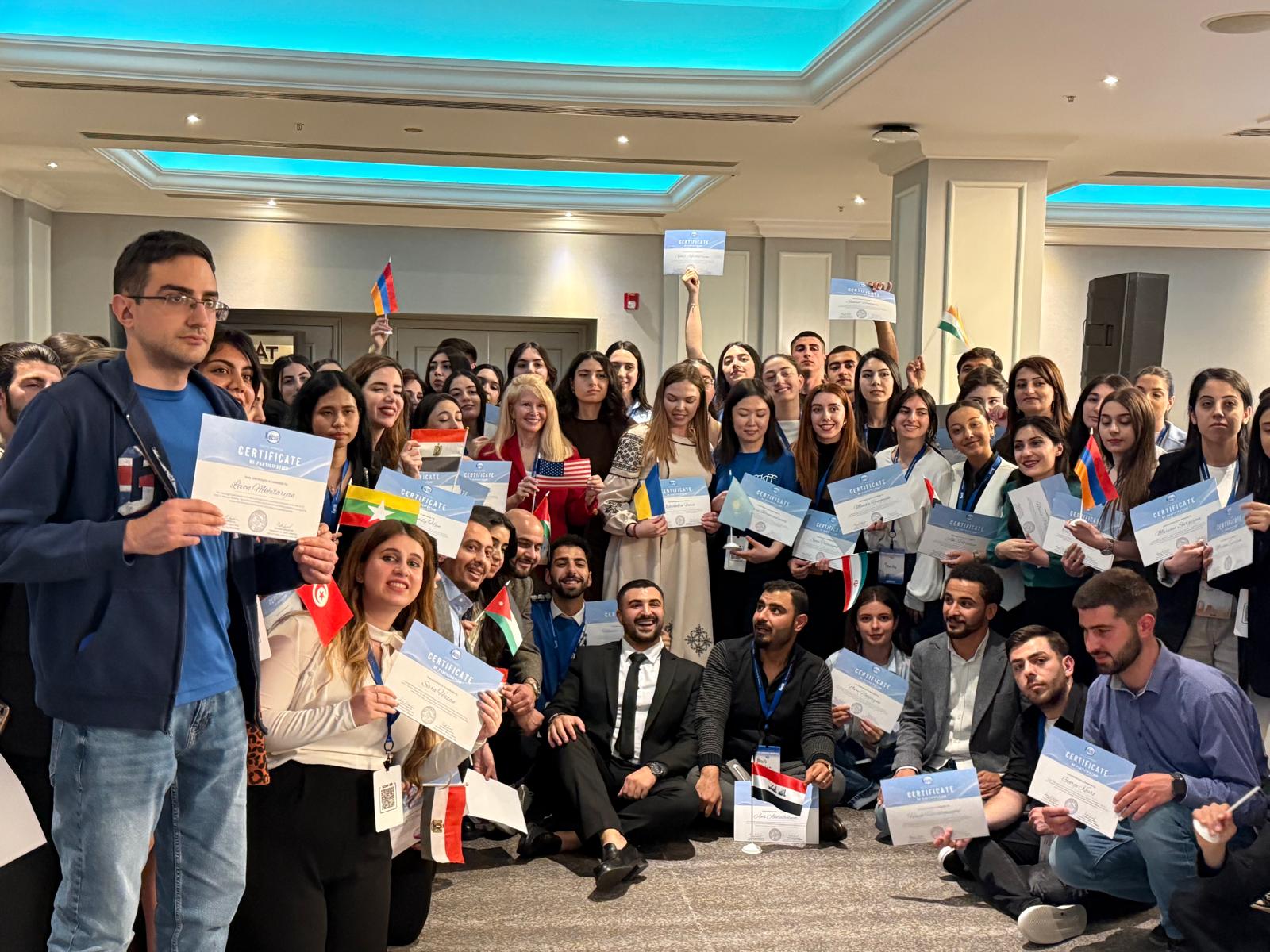 Kectil participants posing with certificates and national flags.