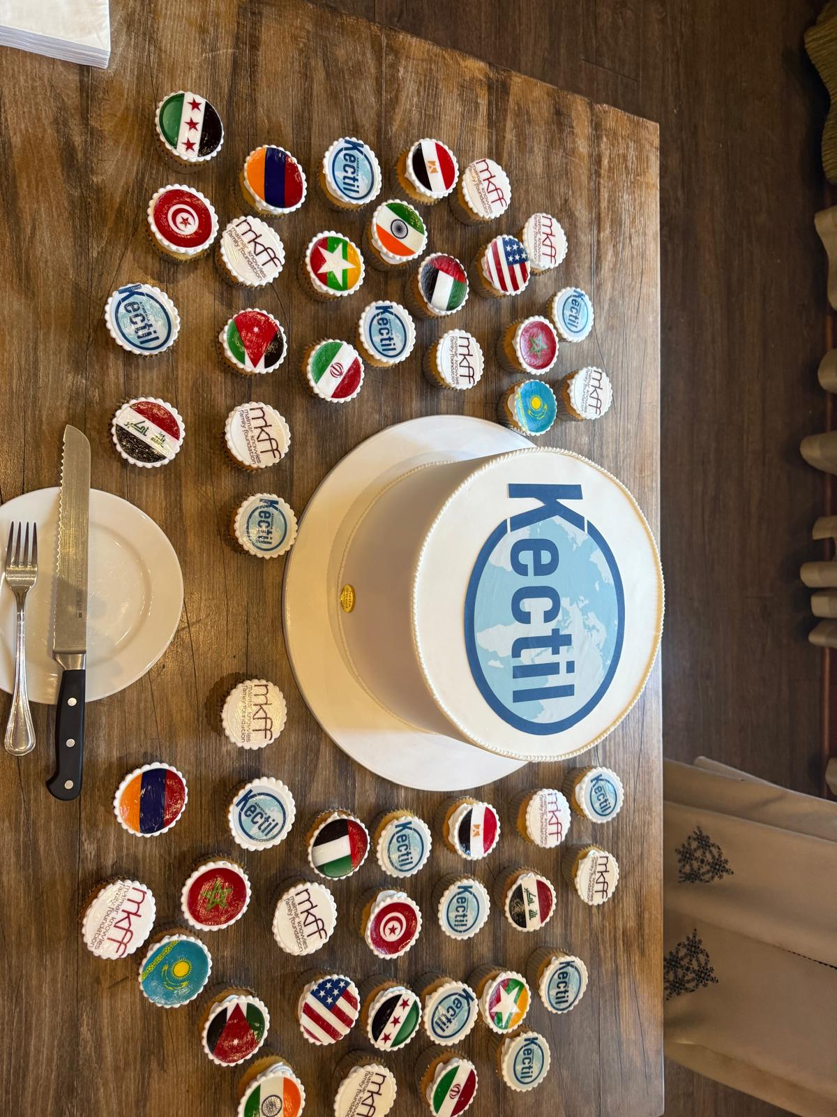 Kectil branded cake and flag cupcakes at a program gathering.